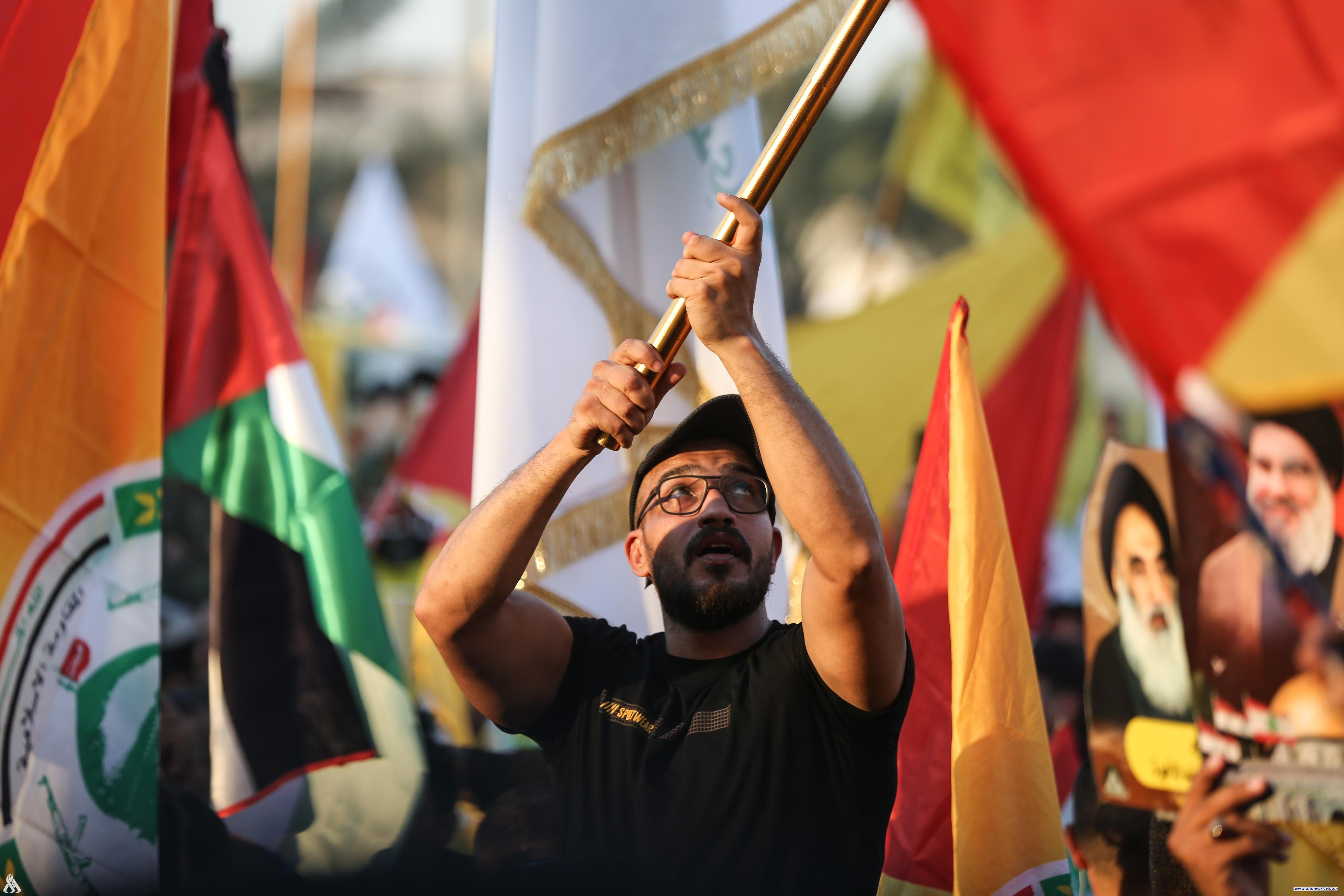 تظاهرة ساحة التحرير تندد بالتهديدات الصهيونية للمرجعية العليا