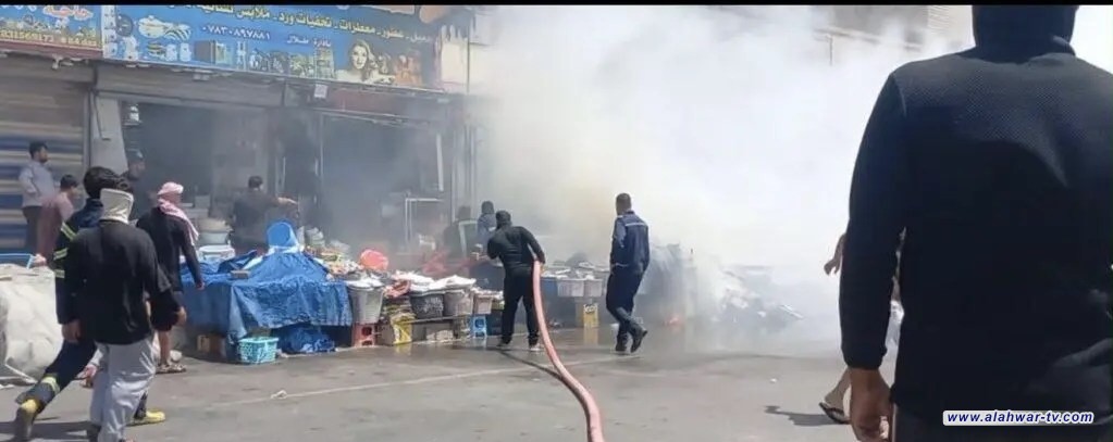 الدفاع المدني يسيطر على حريق شارع النيل في الناصرية وسط خسائر مادية في المحال التجارية